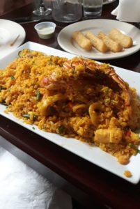 Arroz con Mariscos and Fried Yucca - pic by Ally J. on Yelp - Rinconcito Cubano in Miami