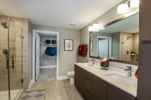 Bathroom with dual vanity and stand up shower